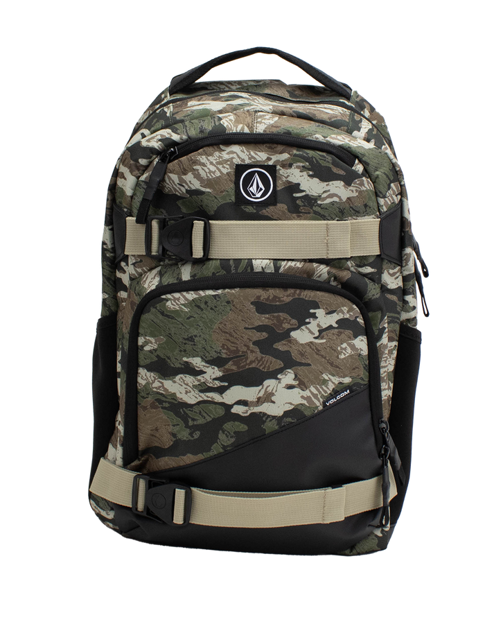 The Volcom Men's Grindstone Skate Backpack features a camouflage pattern with black and beige adjustable straps, two front zippered pockets, a small logo patch, a dedicated laptop sleeve, and side compartments, shown against a plain white background.