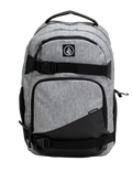 A Volcom Men's Grindstone Skate Backpack in gray and black, featuring two front zippered pockets, black adjustable straps with buckles, a padded laptop sleeve, and a top handle, displayed against a plain white background.