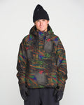 A person wearing the Volcom Men’s Hossegor 20K Pullover—a colorful, patterned jacket made from a recycled V-Science shell—along with black gloves and a black beanie, stands facing the camera against a plain light background.