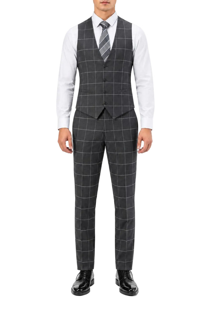 A man wearing a dark gray three-piece suit with a windowpane check pattern, consisting of a vest, matching trousers, and a matching striped tie, styled with a white dress shirt and black dress shoes.