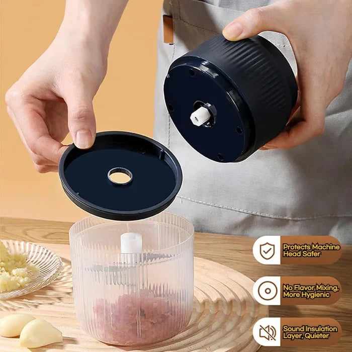 Person using a garlic press with a clear container on a wooden surface.