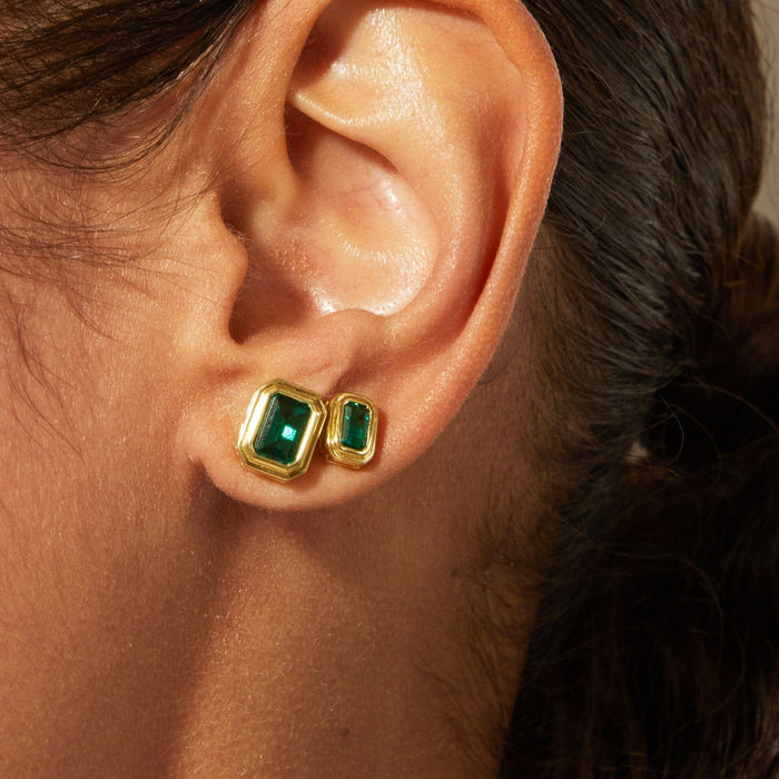 Lifestyle Model side profile close up of woman wearing two stud earrings