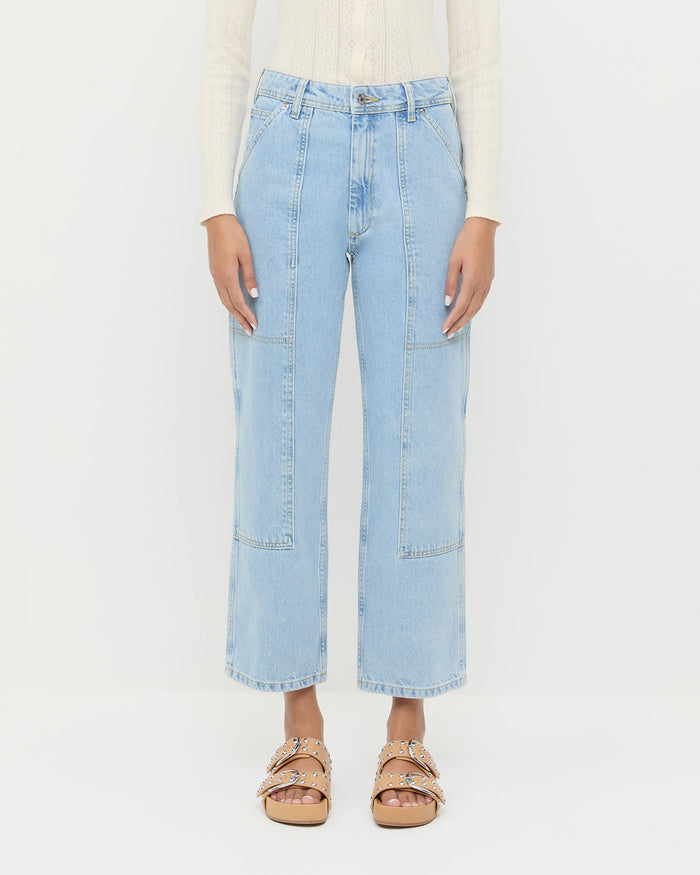 Molly Workwear Jean in light blue denim, Ash Pointelle Cardigan in cream cotton, and Joni Khaki Studded Sandal.