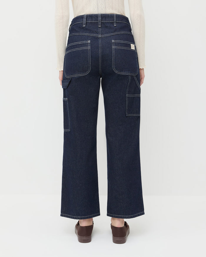 Molly Workwear Jean in dark blue denim, Lolo Pointelle Long-Sleeve Tee in cream cotton, and Cooper Dark Brown Mary Jane Sneaker.