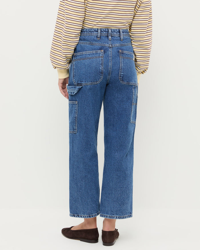 Molly Workwear Jean in medium wash blue denim, Scout Long-Sleeve Top in butter yellow, and Noelle Brown Suede Ballet Flat.