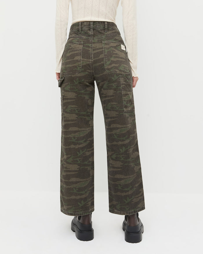 Molly Workwear Jean in dark camo denim, Lolo Pointelle Long-Sleeve Top in cream pointelle, and Suri Brown Leather Lug Boot.