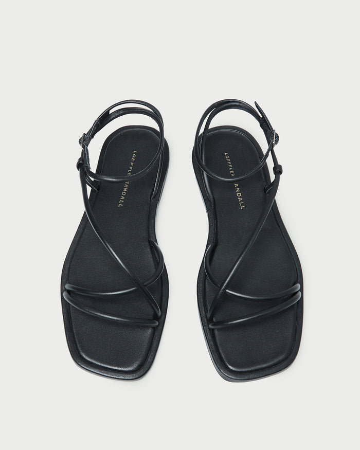 Noor Black Leather Flat Sandal in black leather.