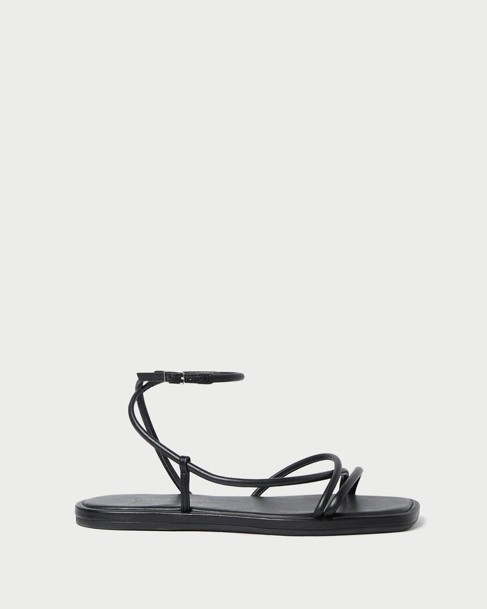 Noor Black Leather Flat Sandal in black leather.