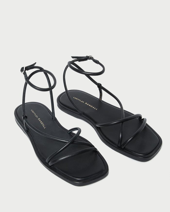 Noor Black Leather Flat Sandal in black leather.