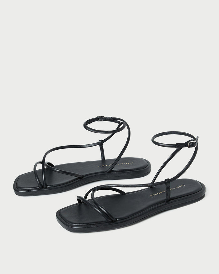 Noor Black Leather Flat Sandal in black leather.