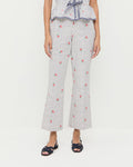 Pasha Trouser in white floral cotton-linen, Pilar Tie-Front Top in white floral cotton-linen, and Shelly Navy Suede Flat Sandal.