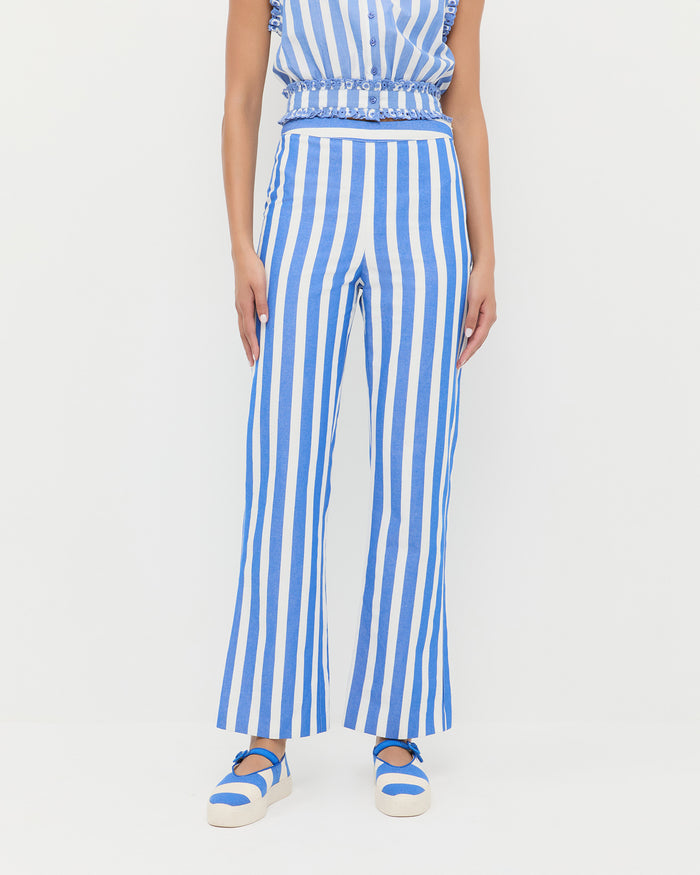 Pasha Trouser in blue and cream stripped cotton-linen, Veda Top in blue and cream stripped cotton, and Cooper Blue Striped Mary Jane Sneaker.