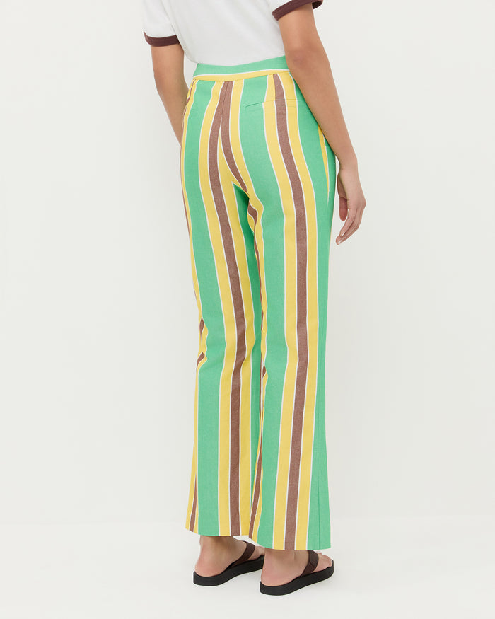 Pasha Trouser in green/yellow/brown striped cotton-linen, Harly Tee in white cotton, and Chase Brown Flip Flop.