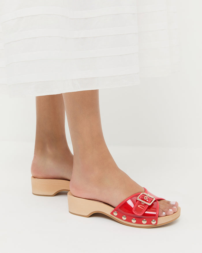 Paulie Red Studded Sandal in red pvc with champagne stud accents.