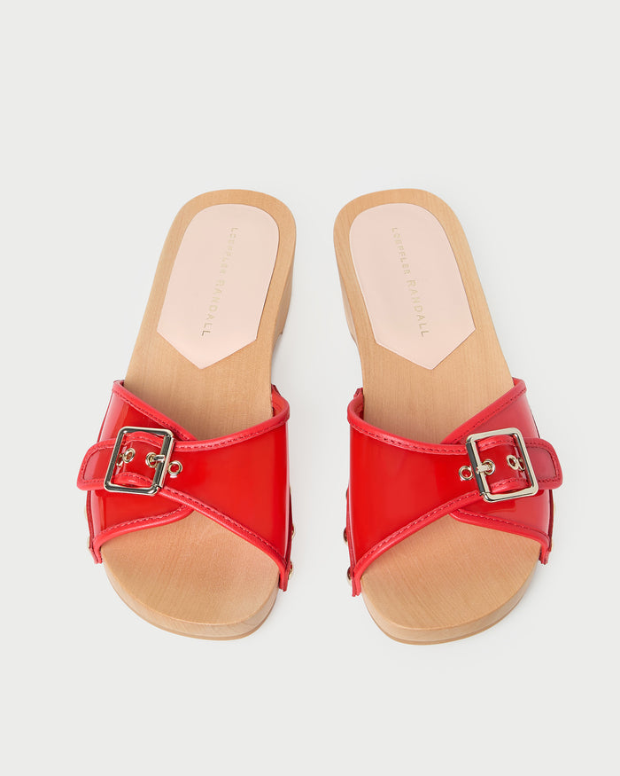 Paulie Red Studded Sandal in red pvc with champagne stud accents.