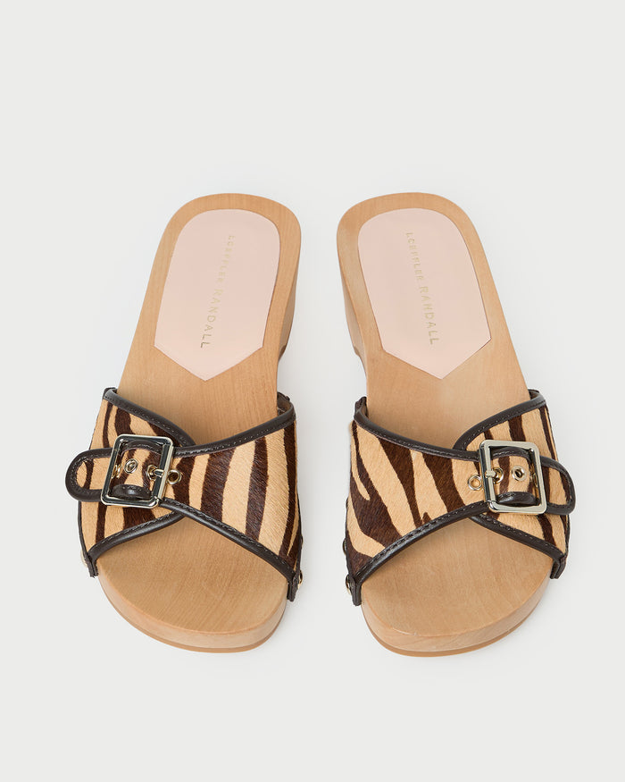 Paulie Zebra Studded Sandal in zebra hair calf leather with champagne accent studs.