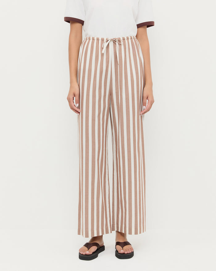 Pella Pant in brown/cream striped cotton, Harly Tee in white cotton, and Chase Brown Flip Flop.