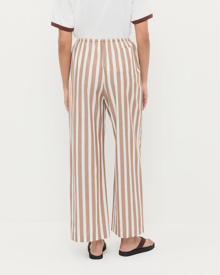 Pella Pant in brown/cream striped cotton, Harly Tee in white cotton, and Chase Brown Flip Flop.