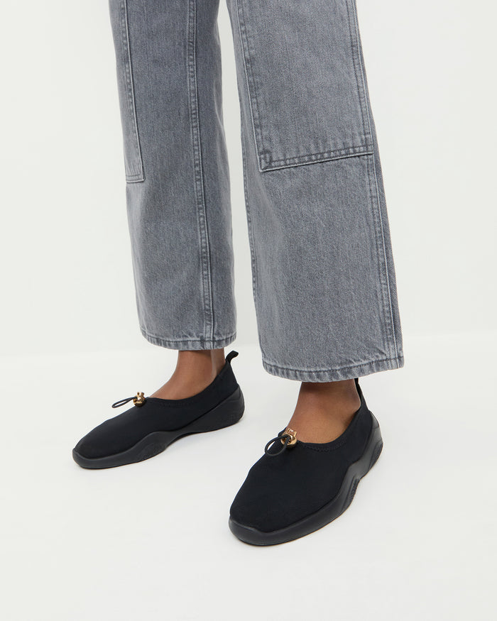 Raina Black Mesh Flat in black mesh and Molly Workwear Jean in grey denim.