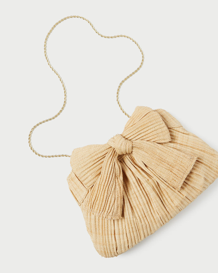 Rayne Natural Bow Clutch in pleated natural straw.