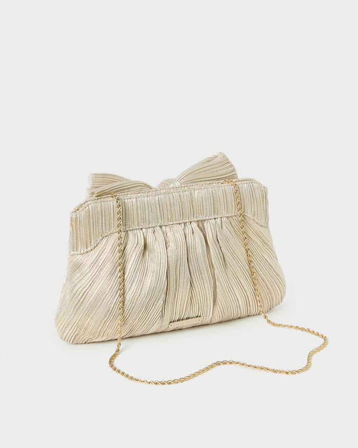 Rayne Platinum Bow Clutch in platinum champagne lamé.