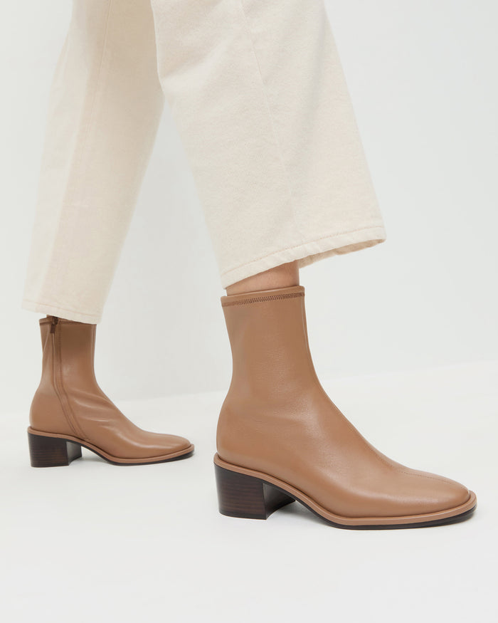 Roxy Safari Leather Ankle Bootie in safari brown leather in Winona Denim Barrel Pant in natural.