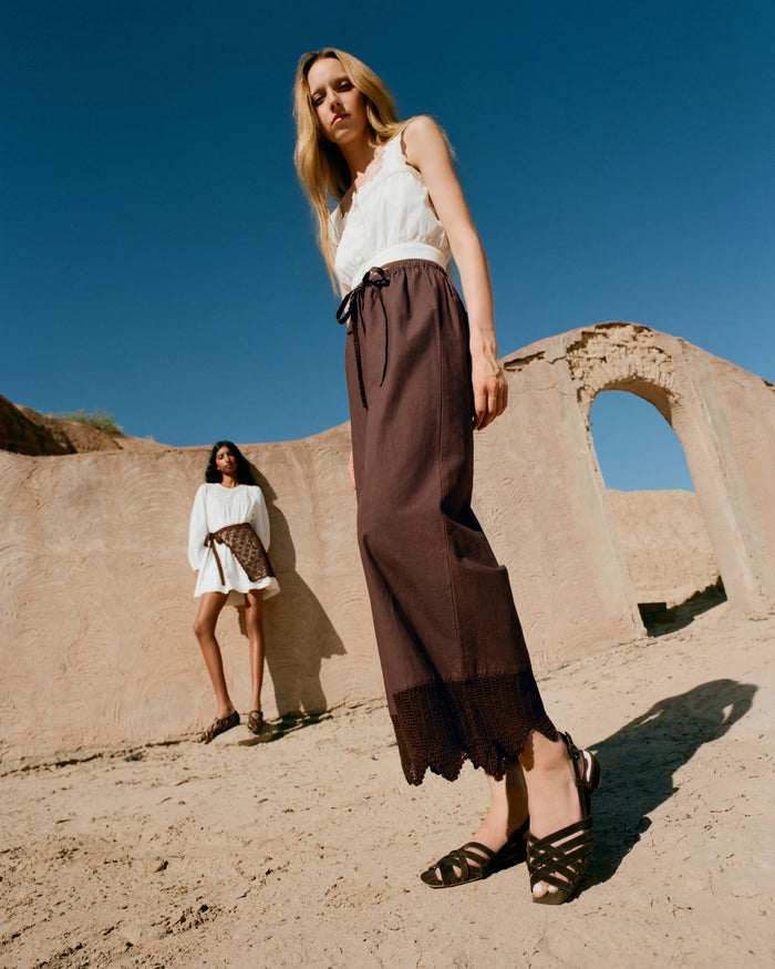 Runa Top in cream cotton, Amani Pant in dark brown cotton, and Shelly Brown Suede Flat Sandal.