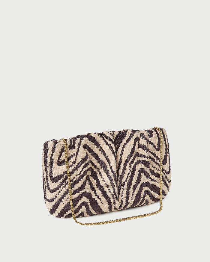 Serena Zebra Gathered Clutch in zebra print woven straw fabric.