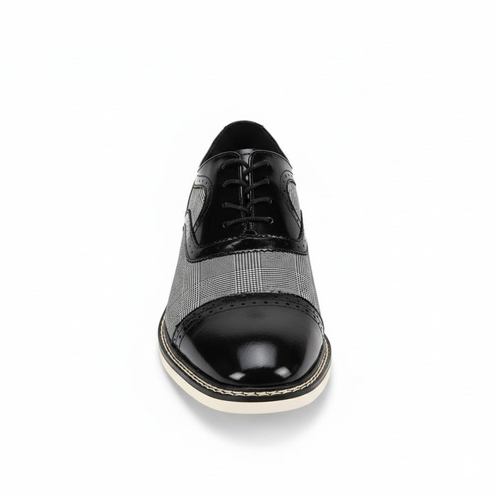 Black and white dress shoe on a white background