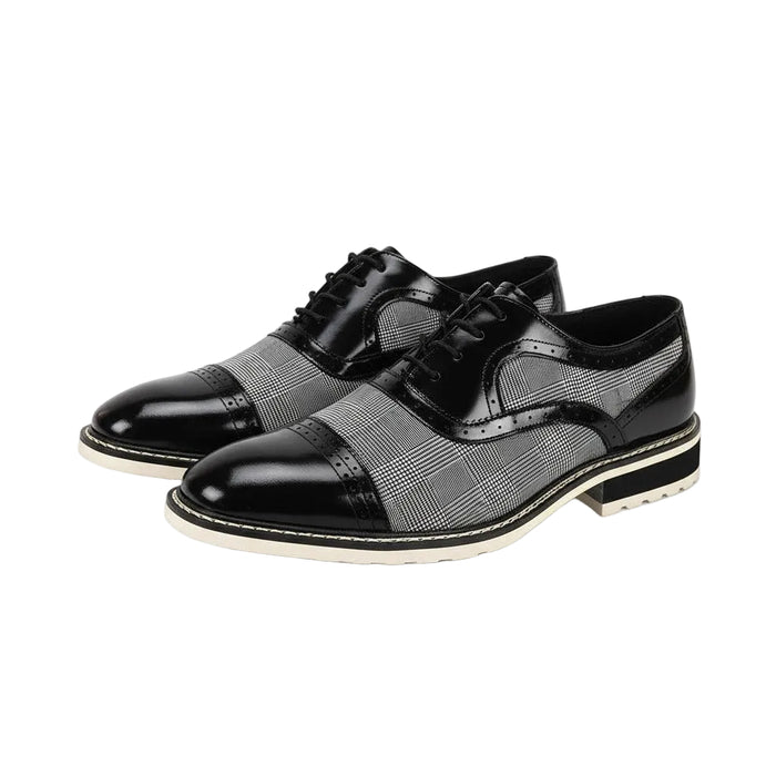 Black and white dress shoes on a white background