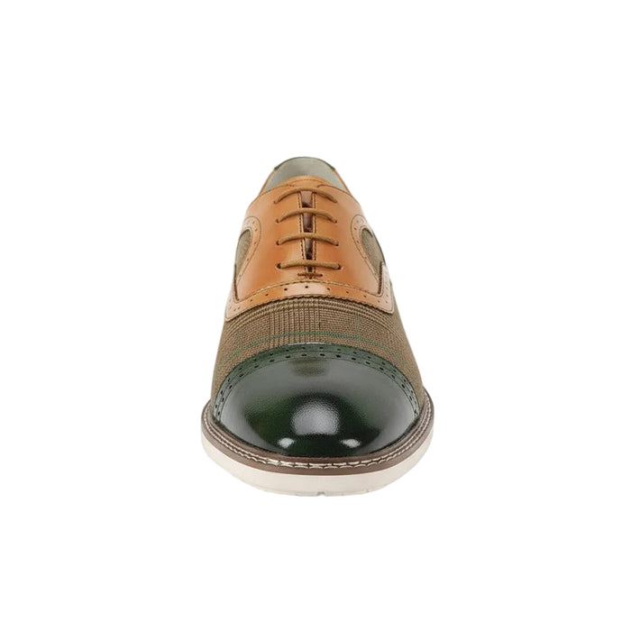 Olive and tan dress shoe on a white background