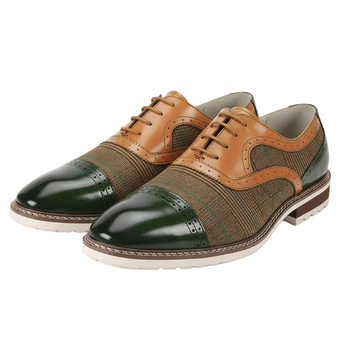 Pair of olive and tan dress shoes on a white background