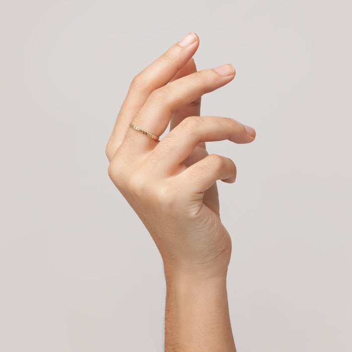 Model. Close up of woman's hand with gold ring
