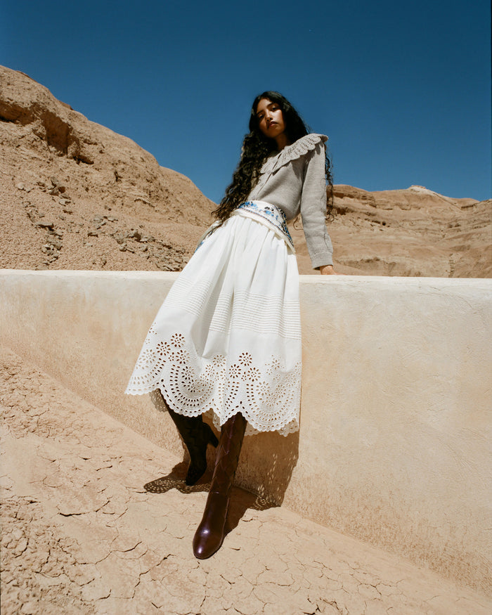 Tinsley Broderie Skirt in cream cotton, Wynn Cardigan in grey wool, and Goldy Espresso Woven Leather Tall Boot.