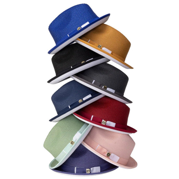 Stack of colorful straw hats on a white background