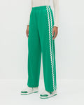 Venus Track Pant in green nylon, Lolo Pointelle Long-Sleeve Top in cream pointelle, and Topspin Cream/Green Court Sneaker.