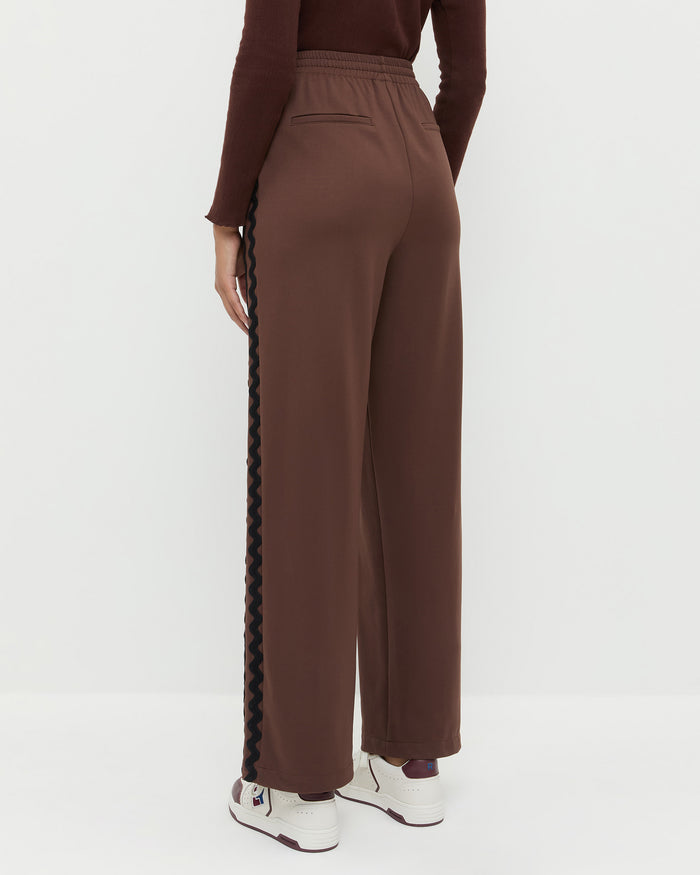 Venus Track Pant in brown nylon, Lolo Pointelle Long-Sleeve Top in espresso brown pointelle, and Topspin Cream/Maroon Court Sneaker.