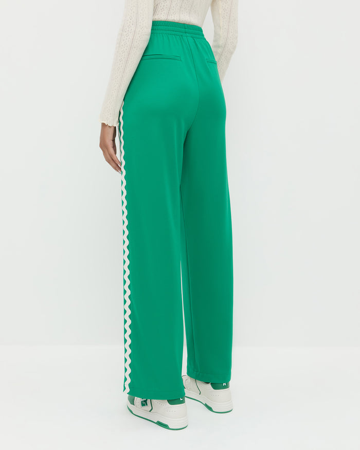 Venus Track Pant in green nylon, Lolo Pointelle Long-Sleeve Top in cream pointelle, and Topspin Cream/Green Court Sneaker.