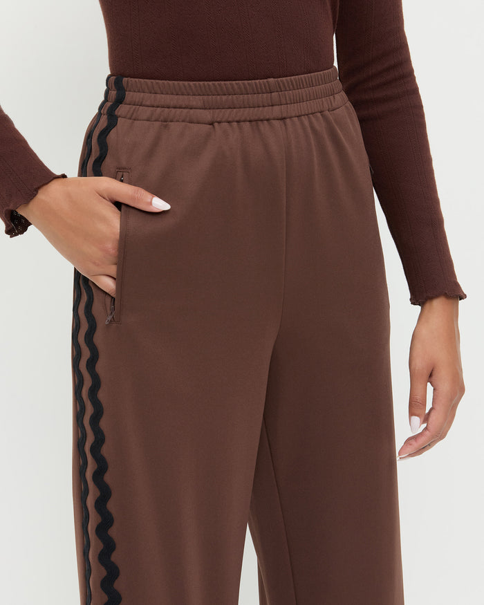 Venus Track Pant in brown nylon and Lolo Pointelle Long-Sleeve Top in espresso brown pointelle.