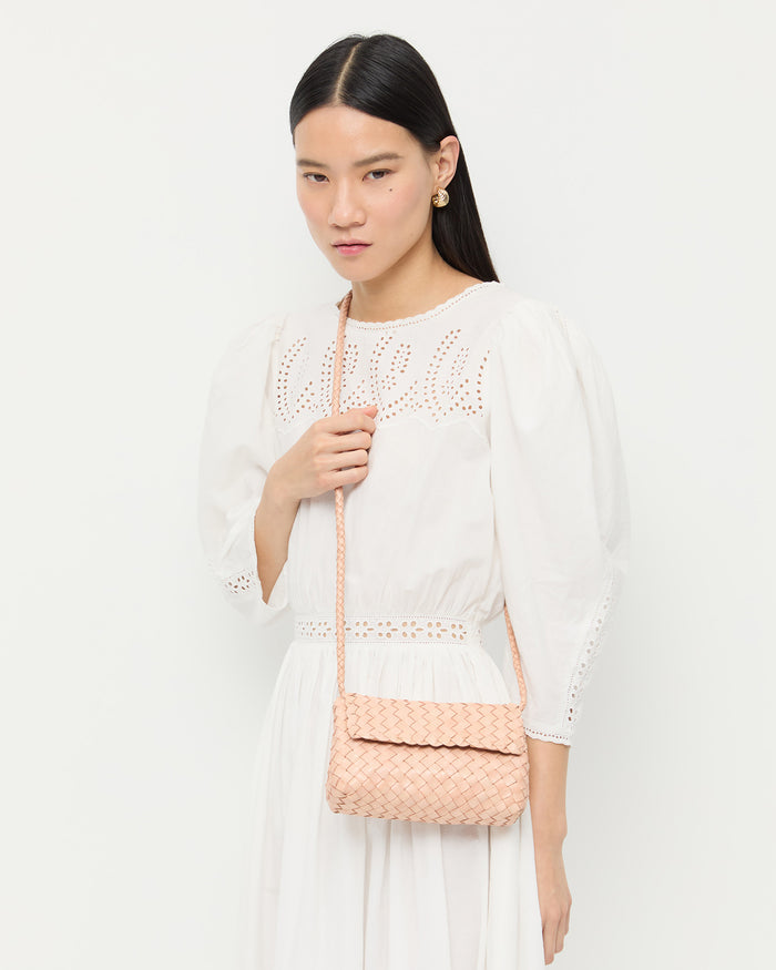 Vinnie Desert Sand Woven Crossbody in desert sand tan woven leather and Thelma Eyelet Dress in cream cotton.