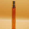 A tall, 8ml perfume vial with a gold-colored cap, that says "Whisky, 1969" printed in gold