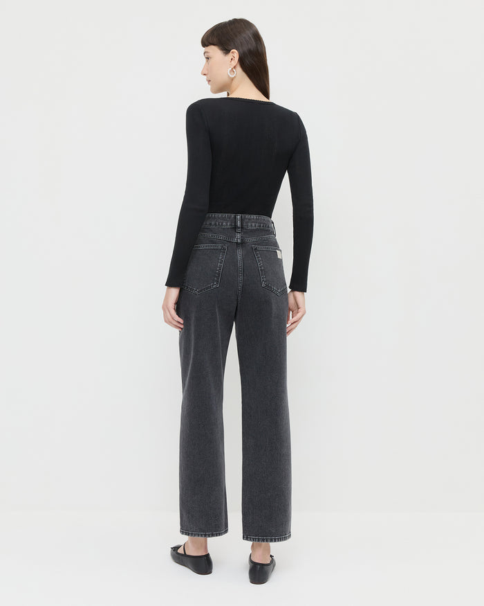 Winona Denim Pant in washed black and silver studs, Kaya Pointelle Long-Sleeve Bodysuit, and Leonie Black Leather Ballet Flats.