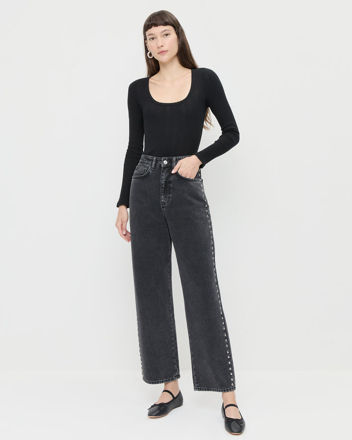 Winona Denim Pant in washed black and silver studs, Kaya Pointelle Long-Sleeve Bodysuit, and Leonie Black Leather Ballet Flats.