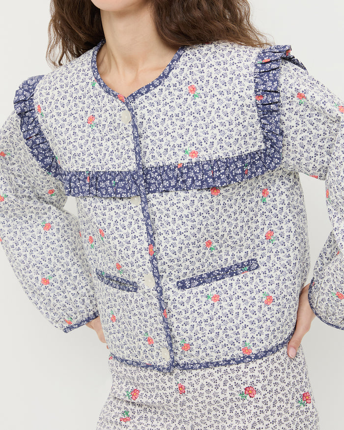 Winslet Jacket in blue floral cotton and Pasha Trouser in white floral cotton-linen.