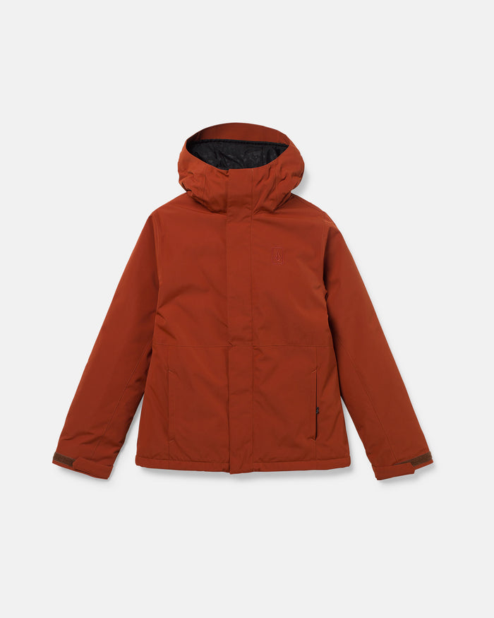 The Women’s Bolt Insulated Jacket by Volcom is a rust-colored hooded winter coat featuring a front zipper, snap buttons, and two side pockets. Designed with long sleeves and adjustable cuffs, this eco-friendly jacket uses recycled insulation for warmth and comfort, all in a sleek minimalist style. Displayed on a plain white background.