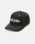 The Women's Coco Hat by Volcom is a black 5-panel baseball cap with white stitching and bold, stylized "Volcom" lettering on the front, displayed against a white background.