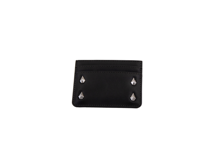 A Volcom Women's Studette Card Wallet in black, featuring a slim design with three card slots and four silver pyramid studs—two on each side—displayed against a plain white background.